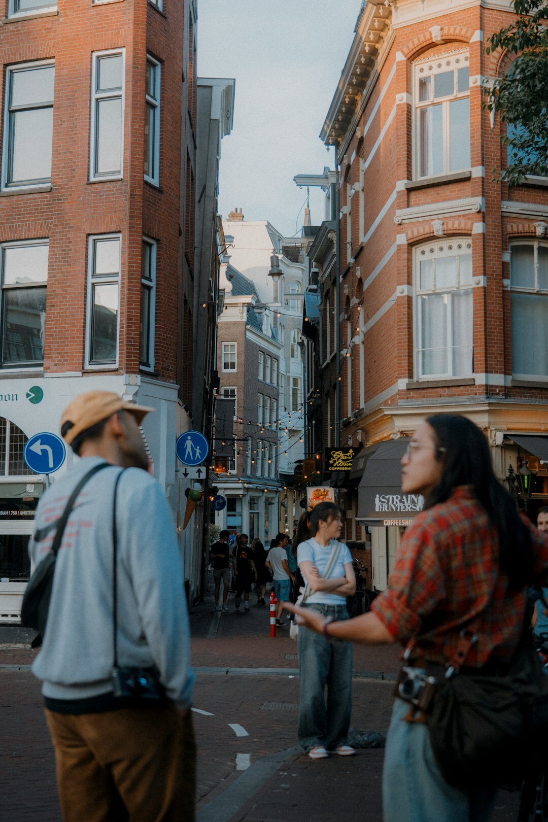 people using smartphones in city
